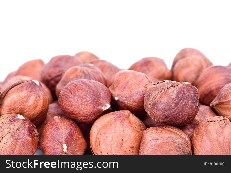 Some hazelnuts isolated on the white background