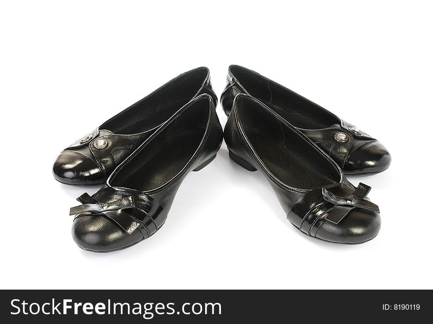 Black womanish shoes on a white background. Black womanish shoes on a white background