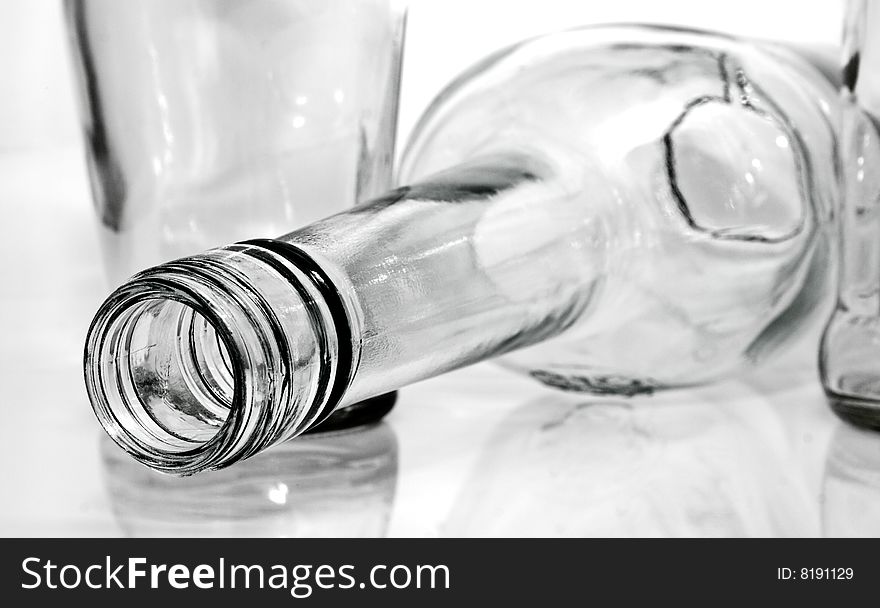 The empty tipped bottle over on a white background