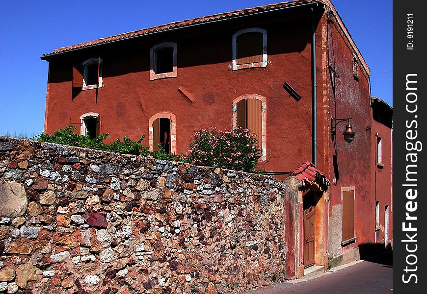 Old ocre building located in ancient hilltop village of Roussillon, Provence, France. Old ocre building located in ancient hilltop village of Roussillon, Provence, France