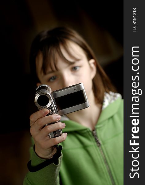 Little girl holding video camera taking pictures. Little girl holding video camera taking pictures