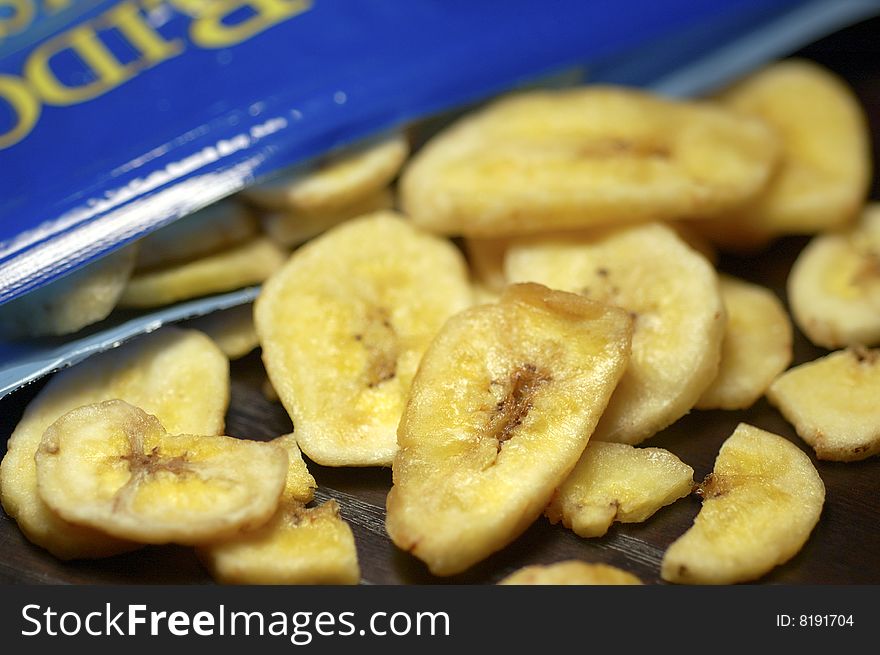 Staying on a diet is tough. Why not snack on a healthy alternative to potato chips. Closeup shot of banana chips. Staying on a diet is tough. Why not snack on a healthy alternative to potato chips. Closeup shot of banana chips.