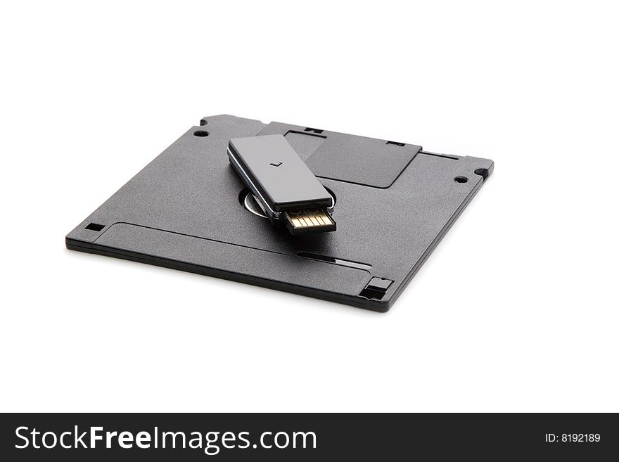 Outdated and modern: floppy disk and usb drive. Outdated and modern: floppy disk and usb drive