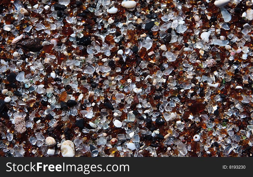 Background or pattern based on the glass fragments on beach. Background or pattern based on the glass fragments on beach