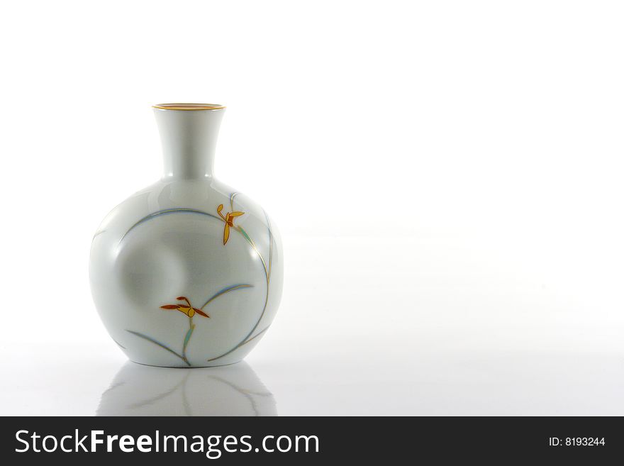 Japanese porcelain sake bottle with floral pattern