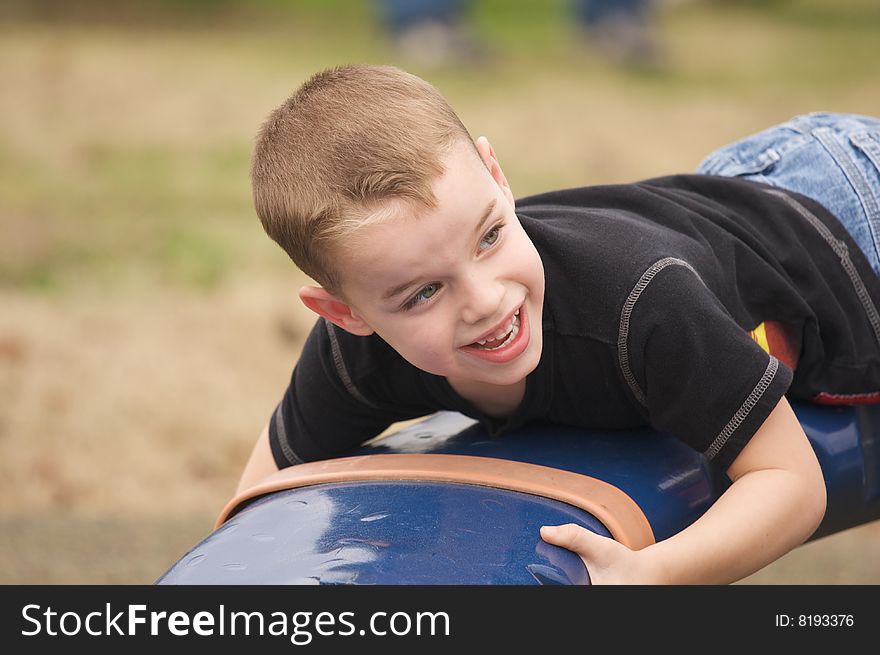 Adorable Child Having Fun Playing at the Playground. Adorable Child Having Fun Playing at the Playground