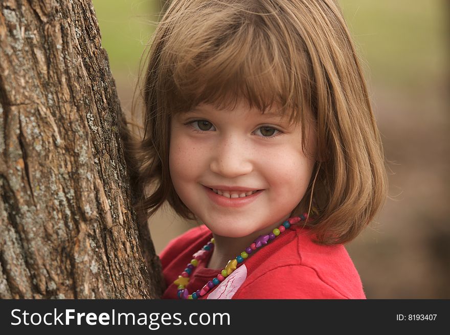 Adorable Young Girl At The Park