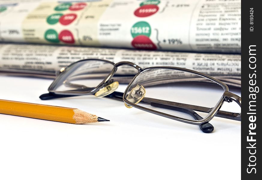 Newspaper and glasses isolated on white background. Newspaper and glasses isolated on white background