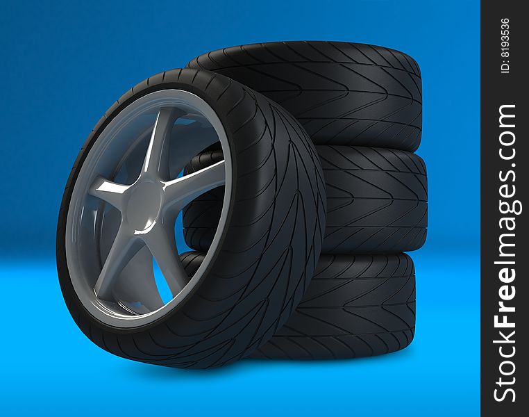 Heap of wheels with aluminium rims over the blue background