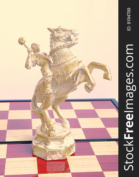 The chess horse has prepared for attack and has lifted a mace. The chess horse has prepared for attack and has lifted a mace.