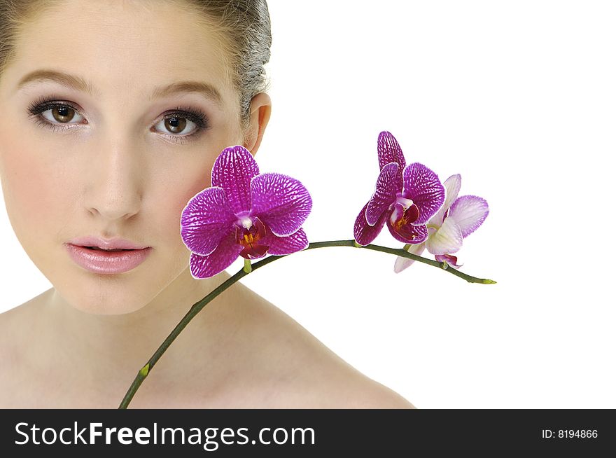 Portrait of young woman with pink orchids. Portrait of young woman with pink orchids