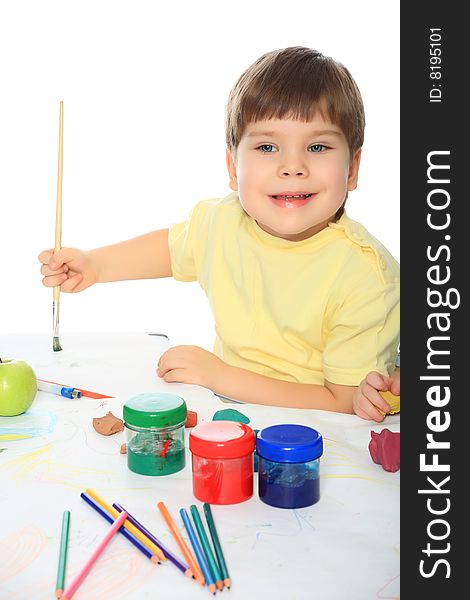 Beautiful child enjoying his game. Shot in a studio. Beautiful child enjoying his game. Shot in a studio.