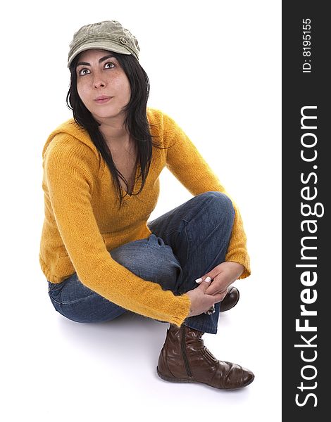 Young casual woman with hat and yellow sweater - isolated on white background