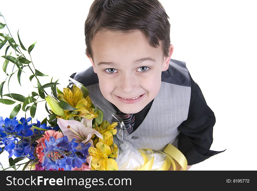 Image of small boy presenting flowers as a gift. Image of small boy presenting flowers as a gift