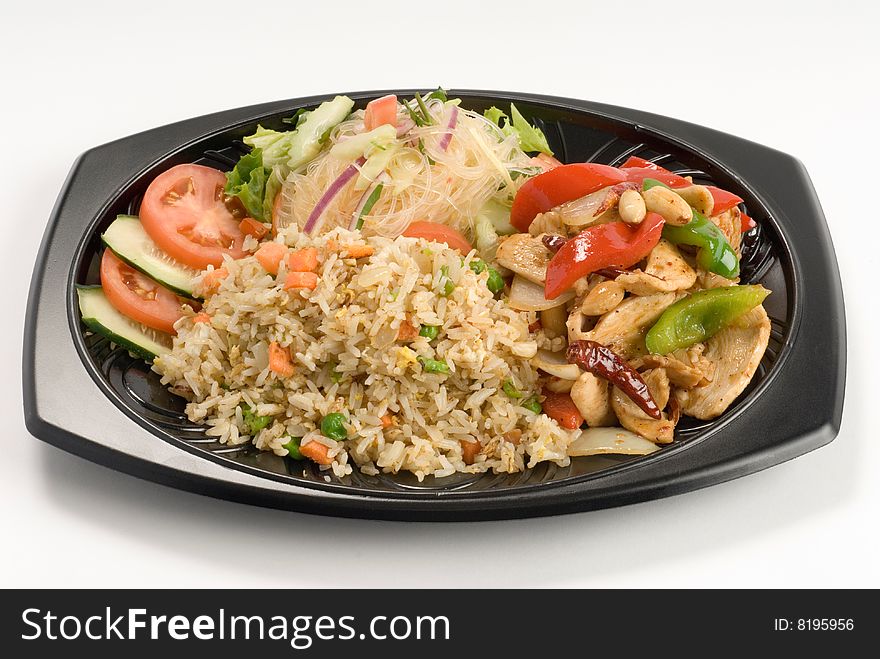 Stir-fried rice with peppers and chicken with a salad