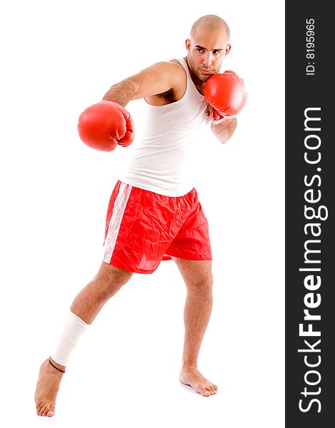 Muscular man in punching pose with white background