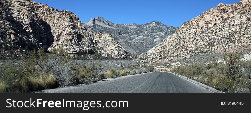 A Lone Stretch of Highway Winding Through the Desert. A Lone Stretch of Highway Winding Through the Desert