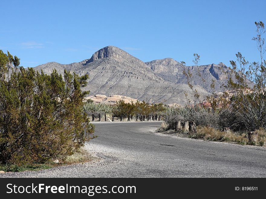 A Lone Stretch of Highway Winding Through the Desert. A Lone Stretch of Highway Winding Through the Desert