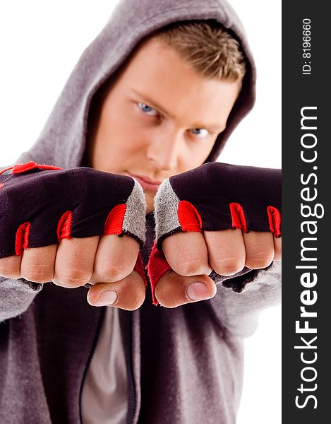 Young male showing fists against white background. Young male showing fists against white background