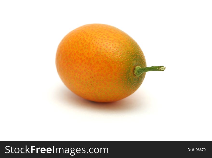 A kumquat isolated with a white background.