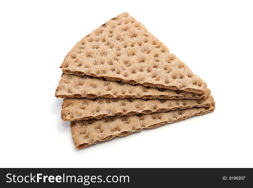 Four slices of healthy cereal crisp bread on white background