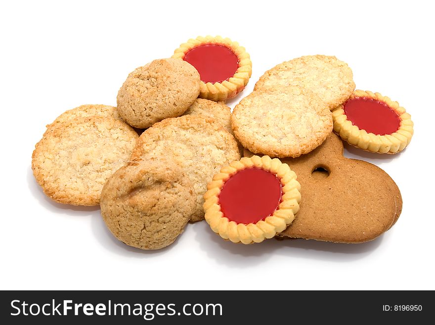 Heap of different cookies and marmalade biscuits on white background