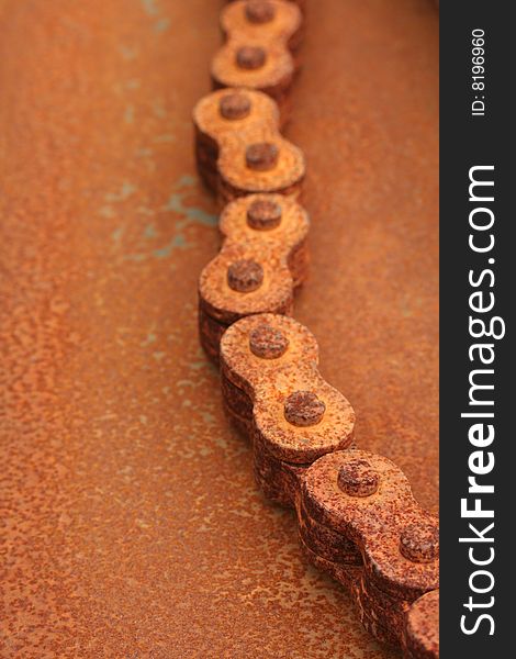 A rusty chain found in the bed of an old International pickup truck. A rusty chain found in the bed of an old International pickup truck.