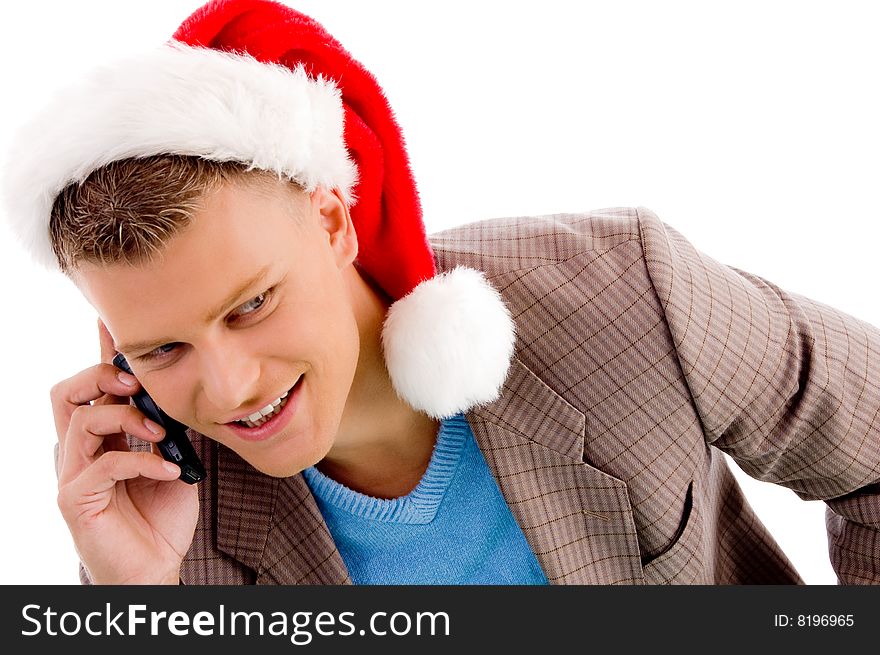 Handsome man with christmas hat talking on mobile with white background