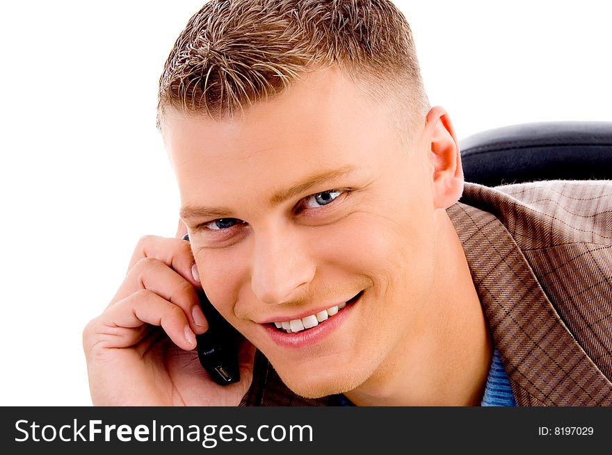 Close up of handsome man talking on mobile on an isolated white background. Close up of handsome man talking on mobile on an isolated white background