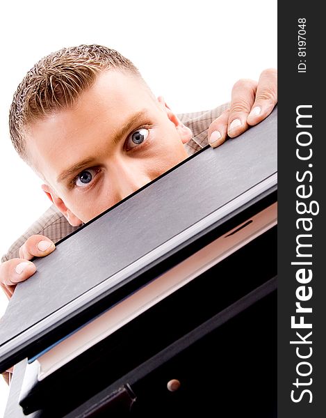 Close up of professional man peeping from files on an isolated background