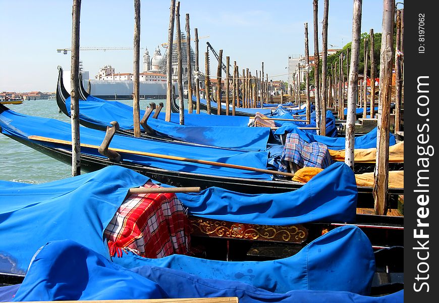 Gondolas moored at the grand canal at Venice Italy. Gondolas moored at the grand canal at Venice Italy