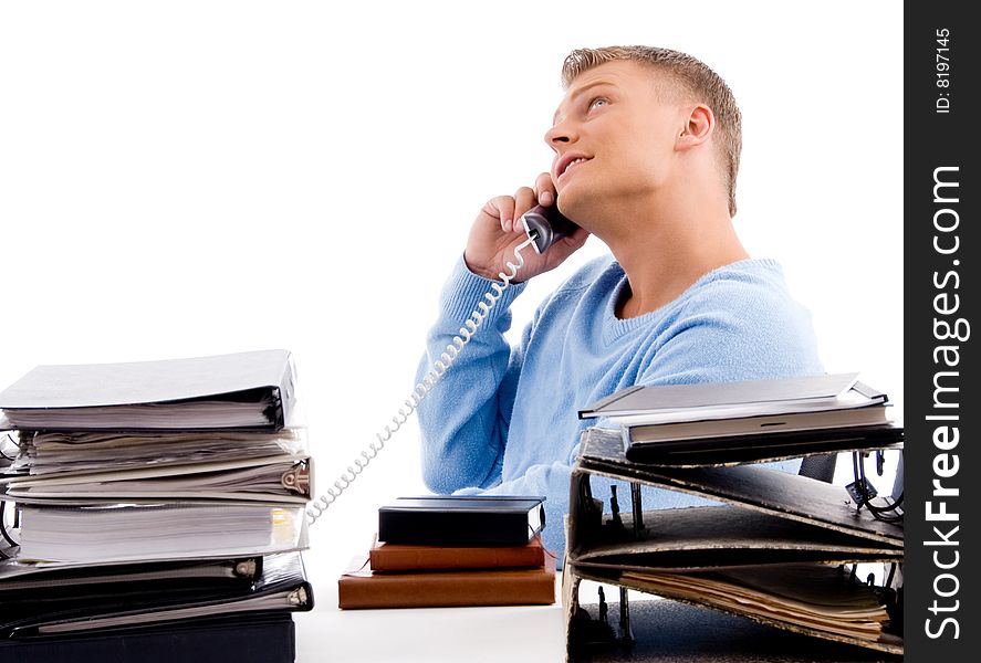 Side view of young professional with phone  in an office