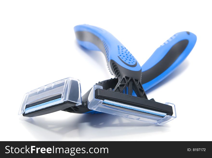 Two blue and black shavers on white background