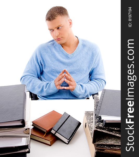 Sitting young professional looking aside in an office. Sitting young professional looking aside in an office