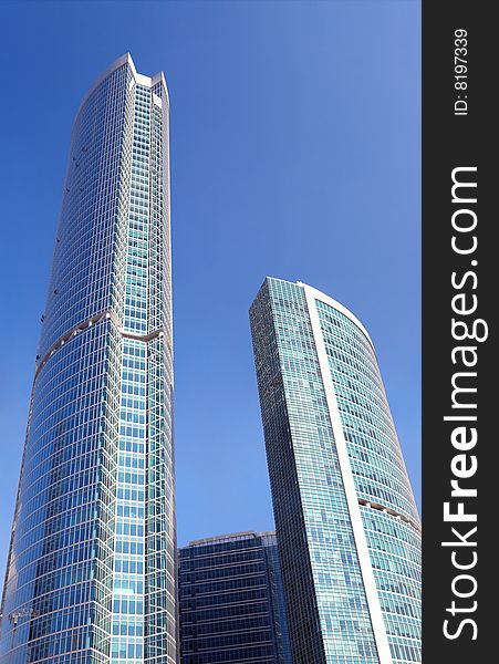 Business Center Under The Blue Sky With The Sun.