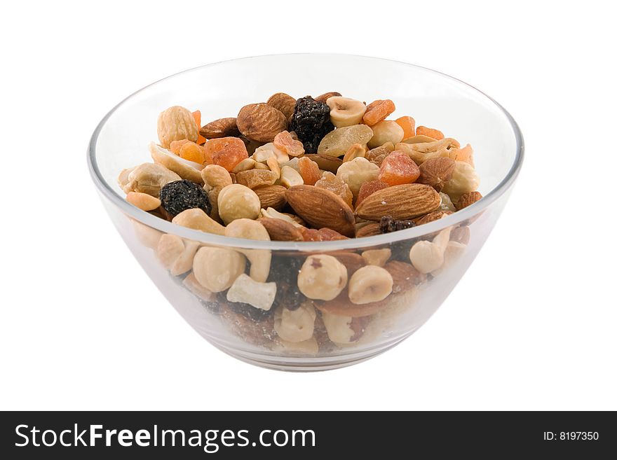 Bowl of nuts and candied fruits isolated on white background. Bowl of nuts and candied fruits isolated on white background