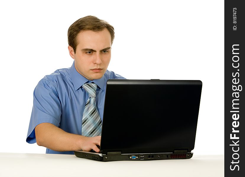 Young businessman working on a laptop. Isolated on white. Young businessman working on a laptop. Isolated on white.