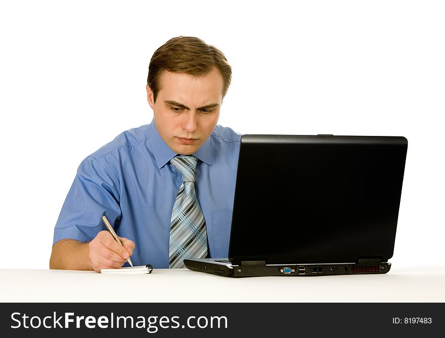 Young businessman working on a laptop. Isolated on white. Young businessman working on a laptop. Isolated on white.