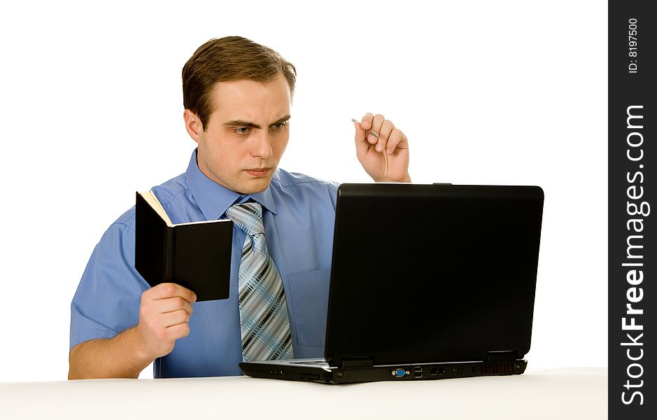 Young businessman working on a laptop. Isolated on white. Young businessman working on a laptop. Isolated on white.