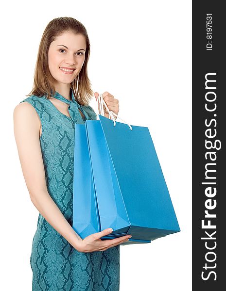 Beautiful girl with shopping bags. Isolated on white