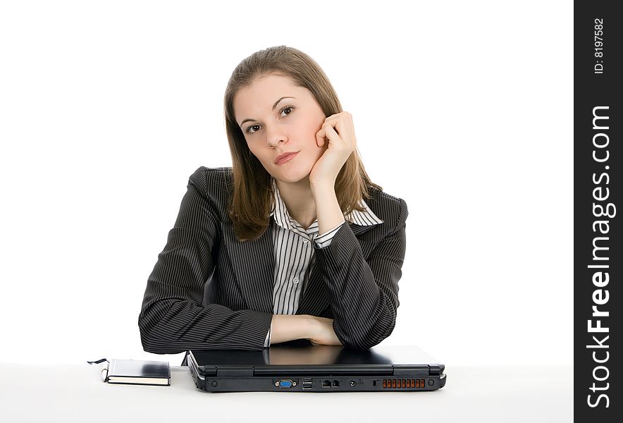 Beautiful young businesswoman with a laptop. Isolated on white.