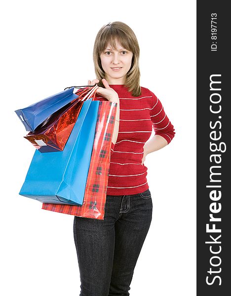 Beautiful girl with shopping bags. Isolated on white