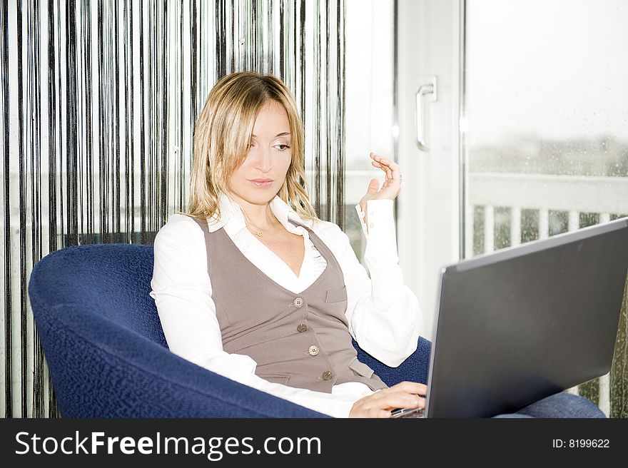 Beautiful businesswoman working at home