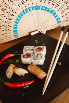 Sushi And Spring Rolls Stock Photography