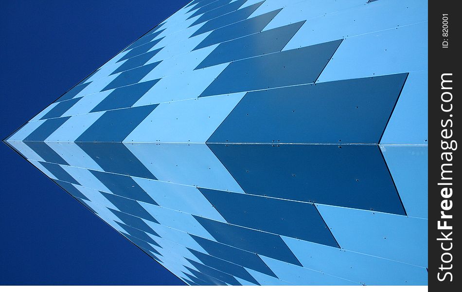 Corner of a blue panelled building. Corner of a blue panelled building