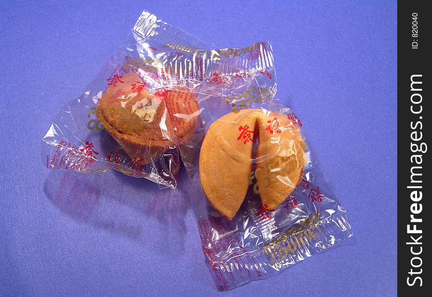 Two fortune cookies in their original packages. Two fortune cookies in their original packages