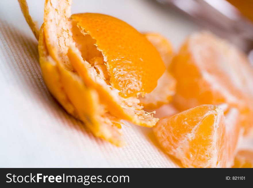 Tangerine pieces with skin on side. Tangerine pieces with skin on side