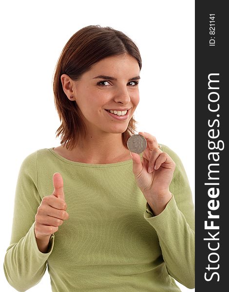 Portrait of a young woman holding silver dollar and thumb up