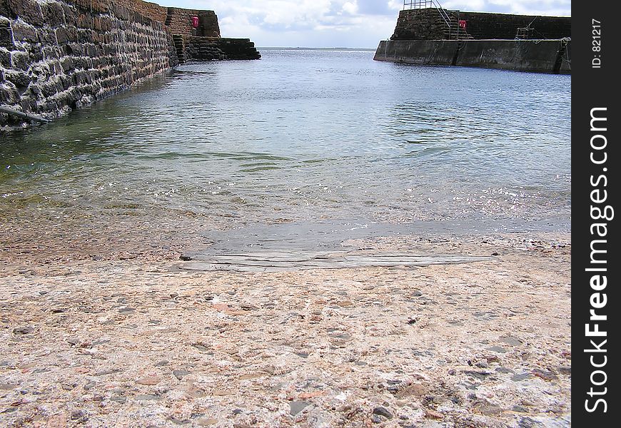 A quaint scottish harbour, showing the calm clear water. A quaint scottish harbour, showing the calm clear water.