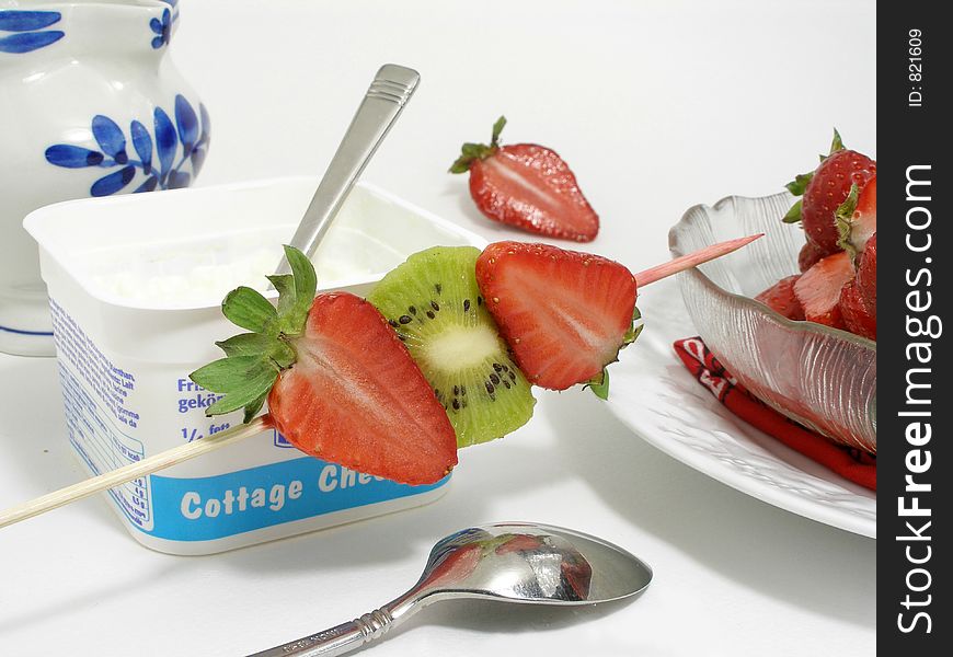 Cottage cheese, fruits skewer and strawberry bowl